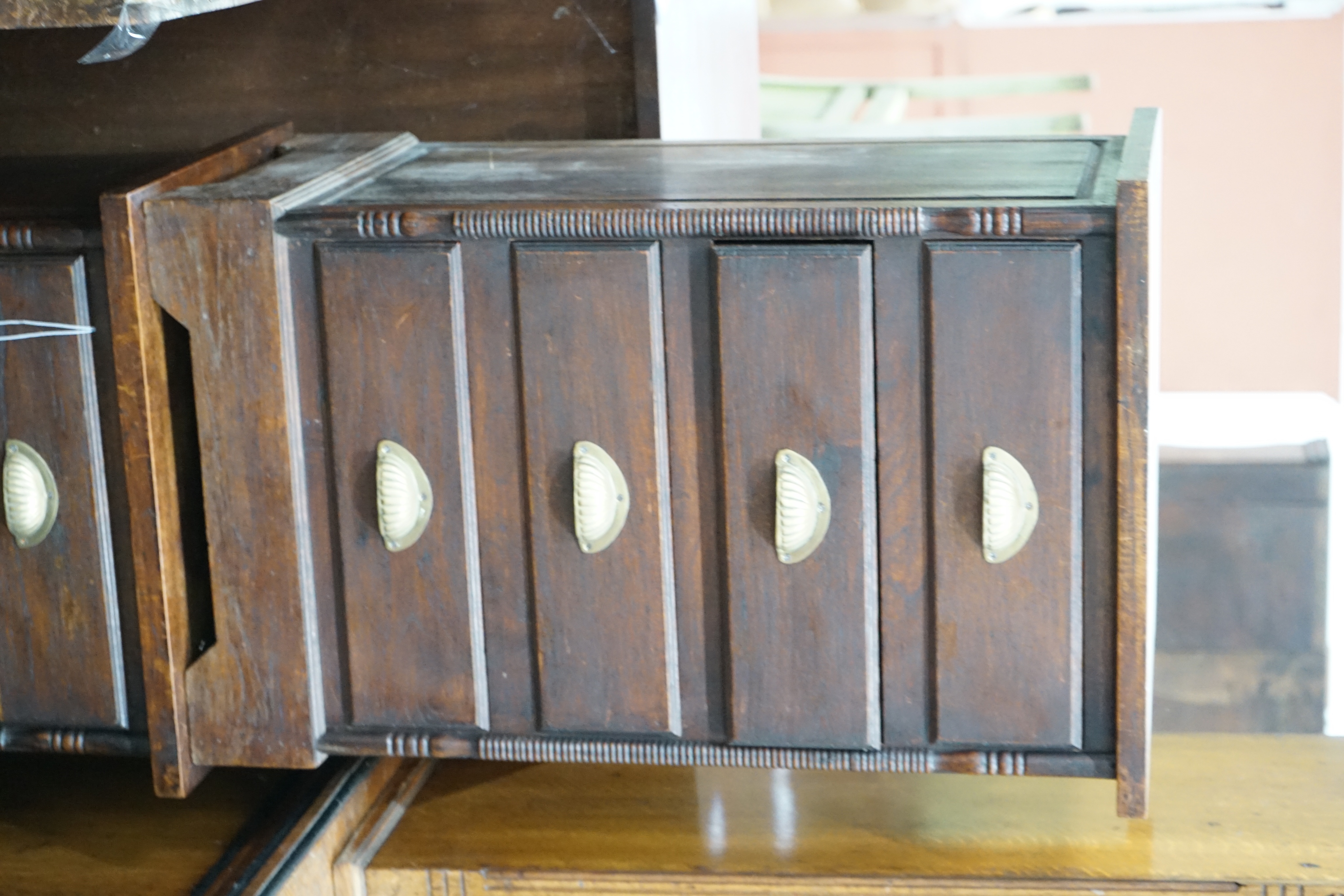 A pair of hardwood four drawer bedside chests, width 47cm depth 38cm height 74cm